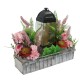 Artificial flowers, wooden basket with grave candle