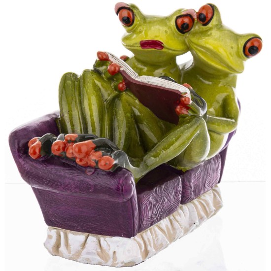 Two figures of frogs with a book