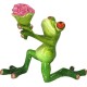 A figure of a frog with a bouquet of flowers